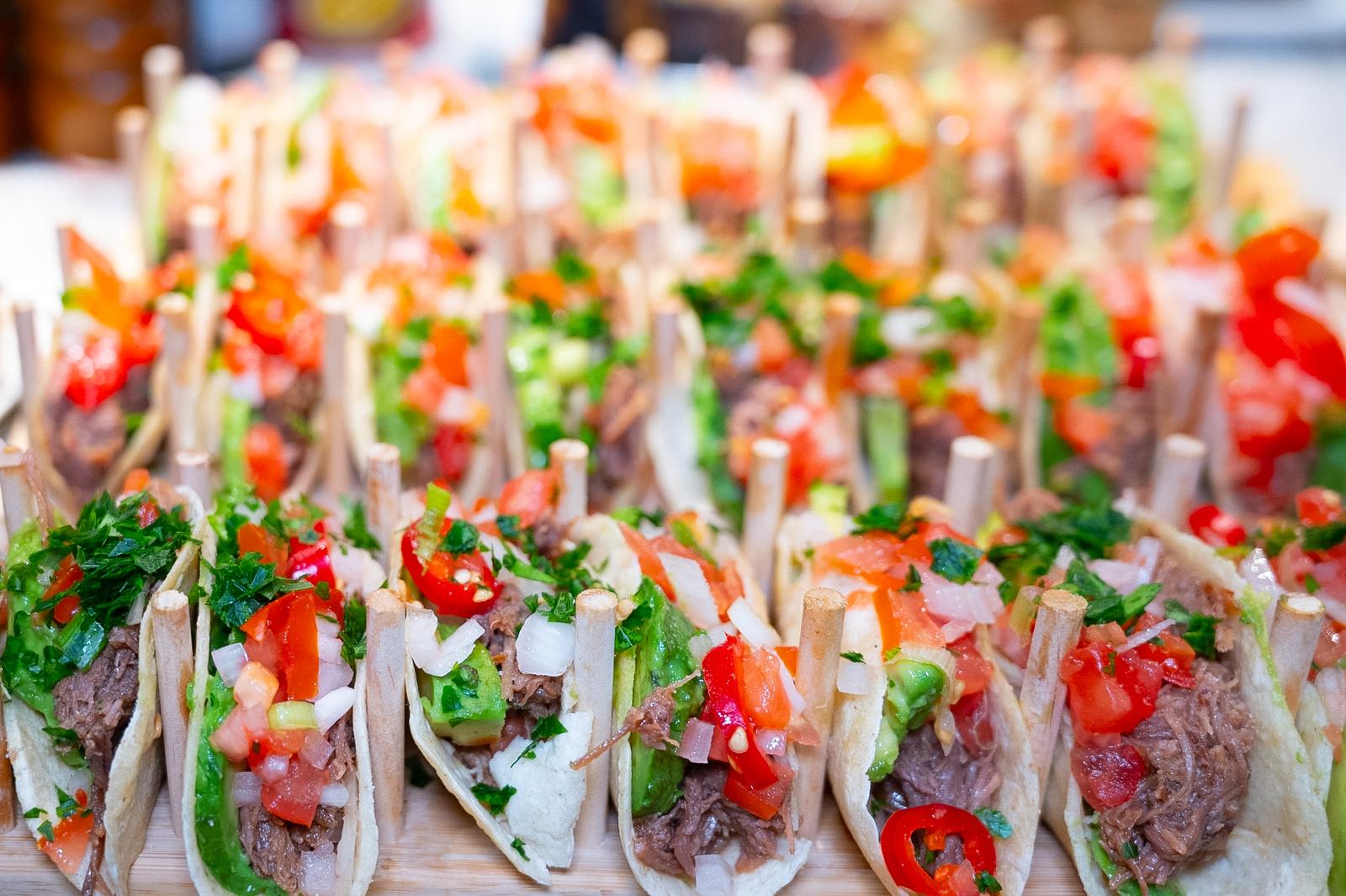 An abundant display of colorful mini tacos