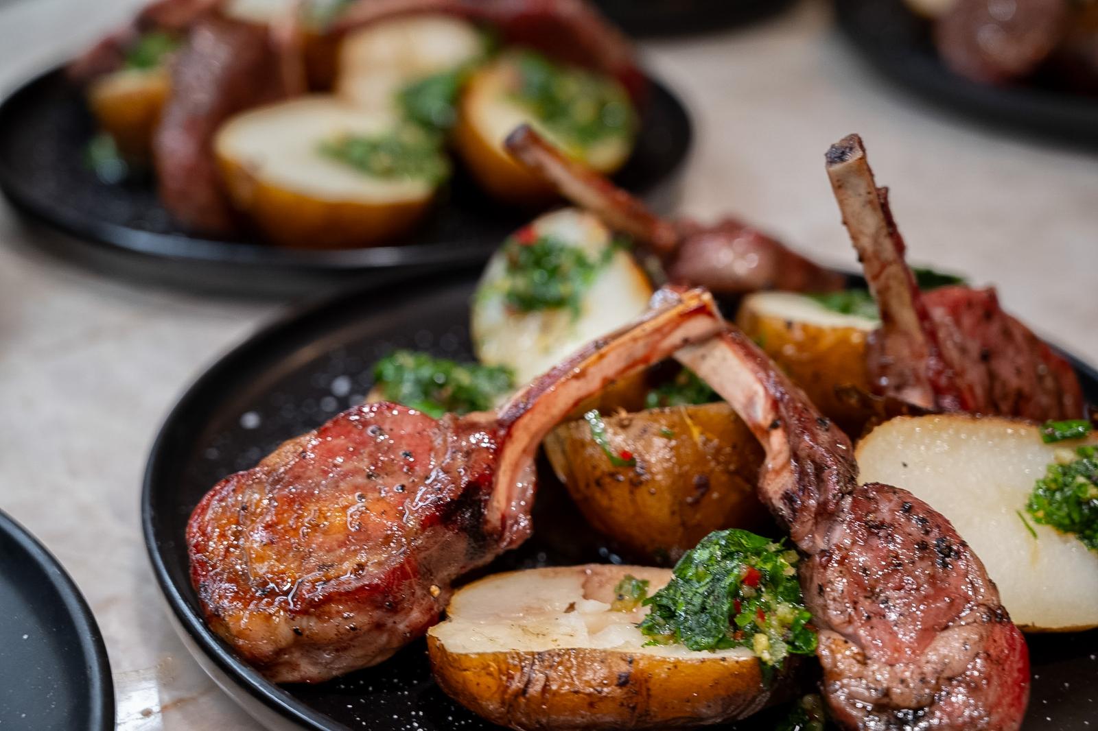 Plated lamb chops with potatoes and herb sauce